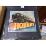 A BOXED VINTAGE HORNBY TIN PLATE TRAIN SET INCLUDING LOCOMOTIVE AND TENDER TRACK ECT