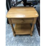 AN 'ERCOL' LIGHT ELM SIDE TABLE / BEDSIDE CHEST OF DRAWERS, GOLD STAMP TO SIDE