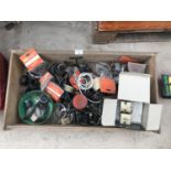 A BOX CONTAINING VARIOUS REELS AND REEL PARTS