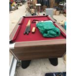 A GOOD QUALITY SUPREME POOL LEAD BASED POOL TABLE 189CM X 110CM WITH BALLS, TRIANGLE, CUES, BRUSH