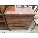 A MAHOGANY CHEST OF FOUR DRAWERS WITH DRESSING SLIDE