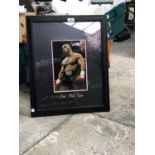 A SIGNED PHOTOGRAPH OF MIKE TYSON