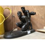 A BRONZE FIGURE OF A GOLFER AND HIS CADDY (CADDY A/F ON BACK OF LEG)