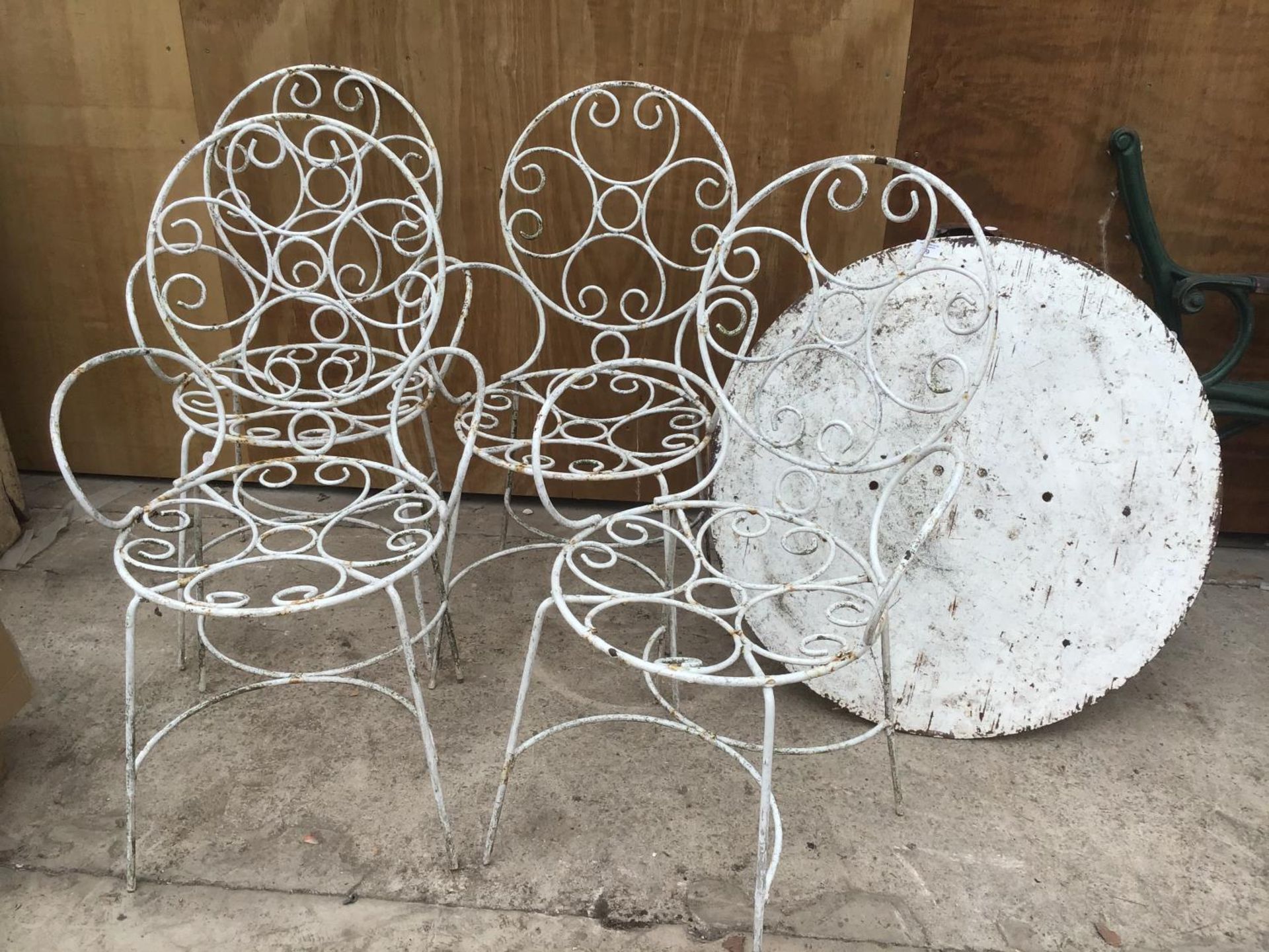 A WHITE ORNATE CAST IRON PATIO SET WITH TABLE TOP AND STAND (A/F) AND FOUR CHAIRS