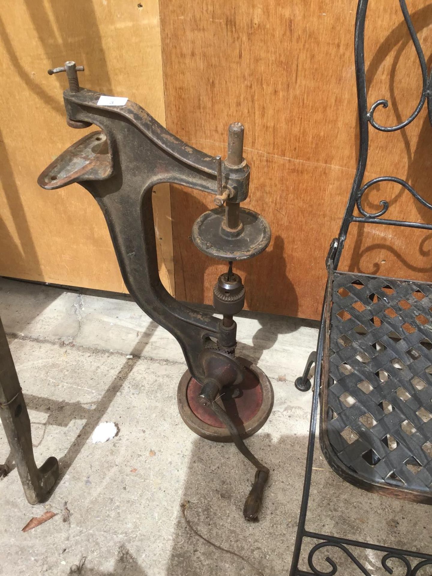 A VINTAGE DRILL PRESS