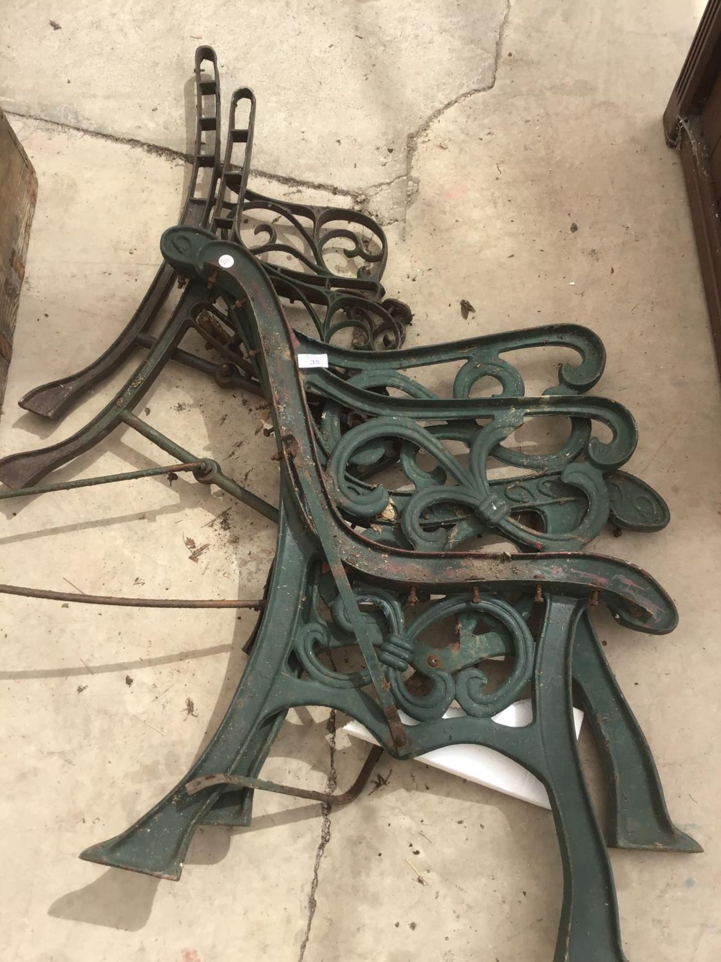 TWO PAIRS OF CAST IRON BENCH ENDS