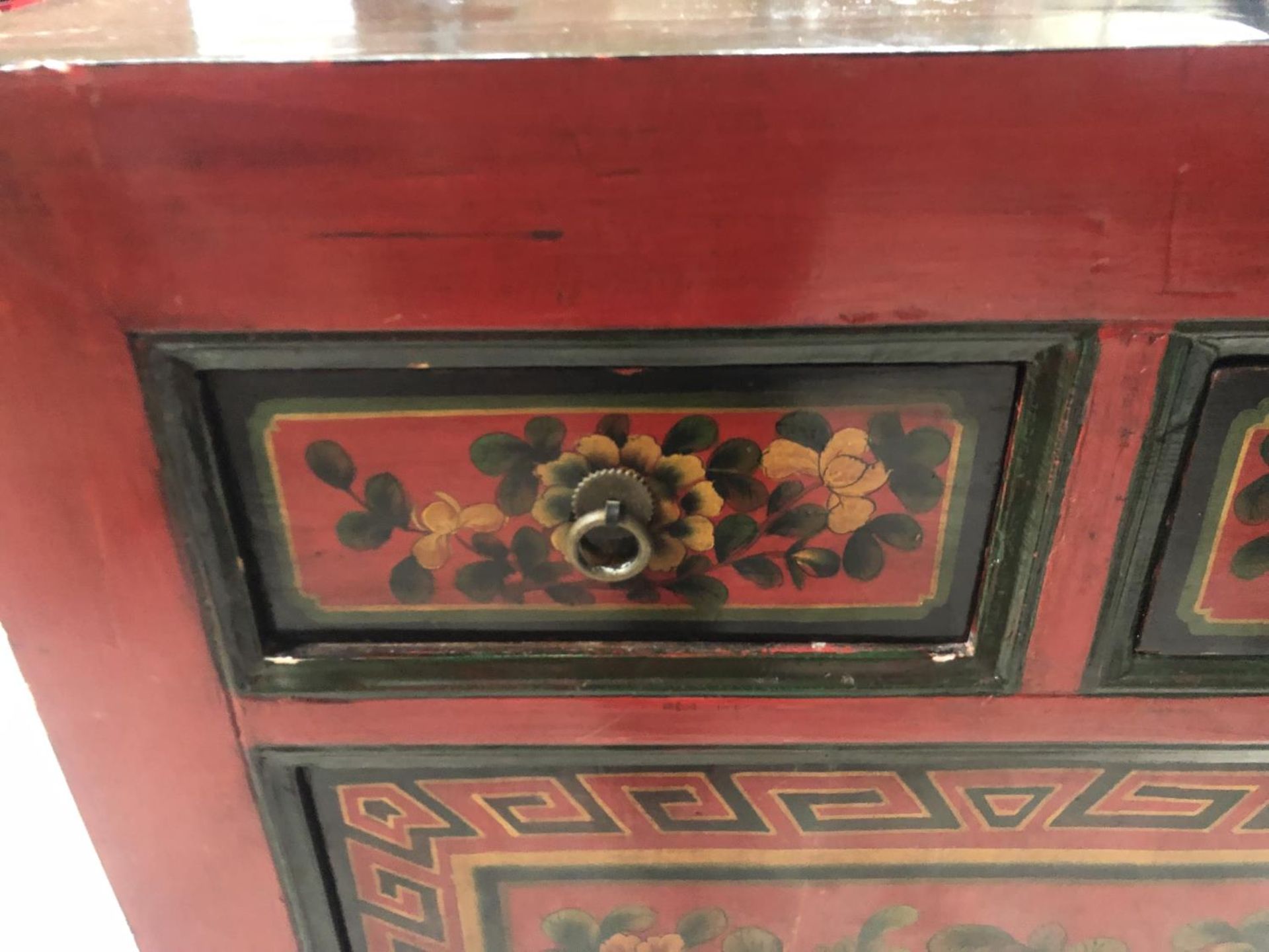 AN ORIENTAL RED LACQUERED CABINET WITH TWO DRAWERS AND LOWER DOOR - Image 2 of 4