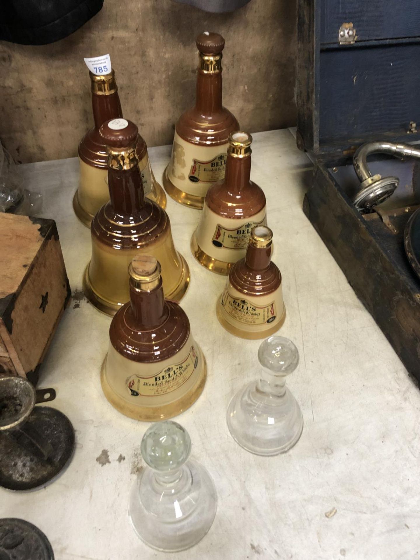 A GROUP OF EMPTY 'BELLS' WHISKY DECANTERS