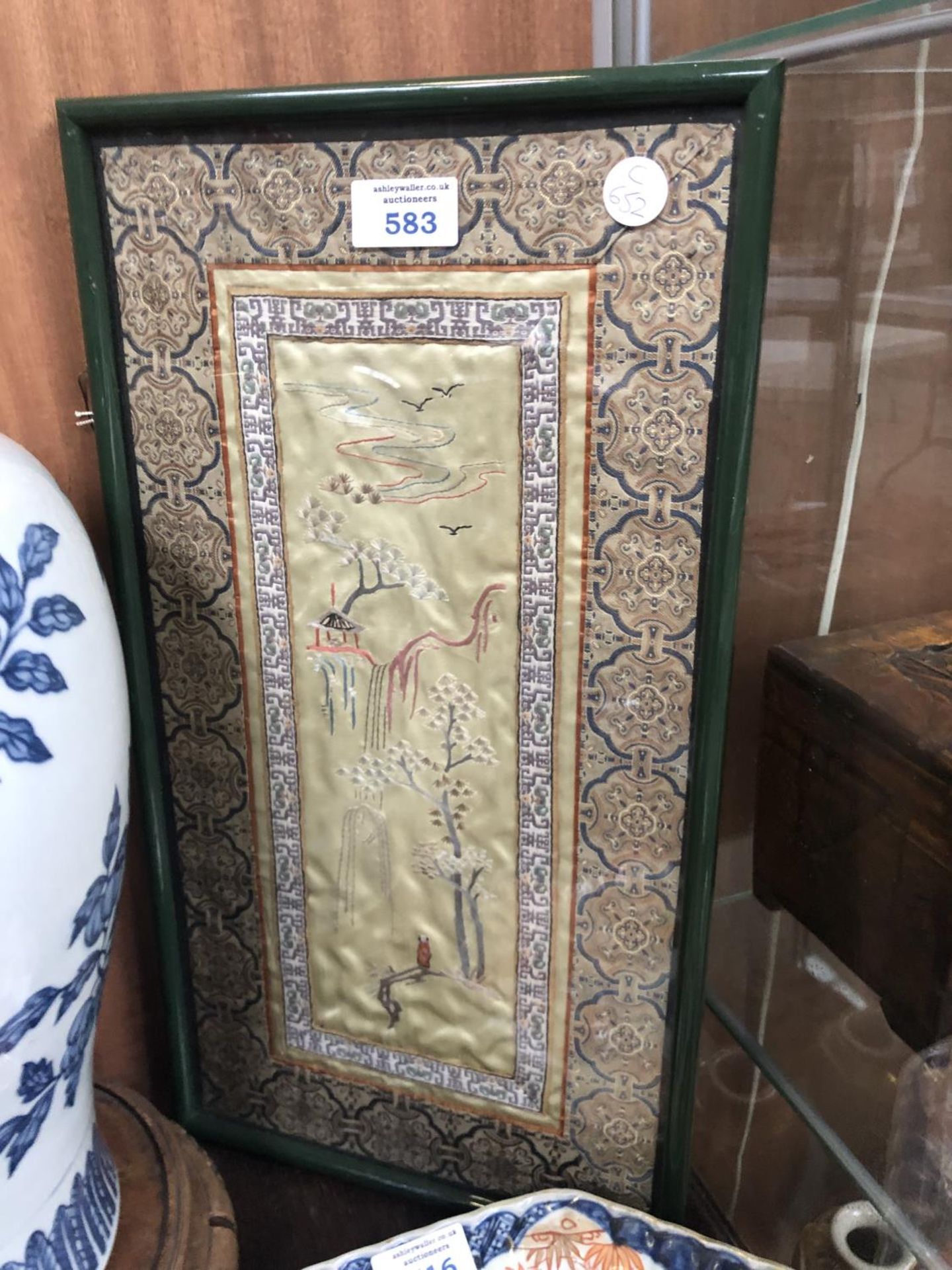 A FRAMED ORIENTAL SILK PICTURE