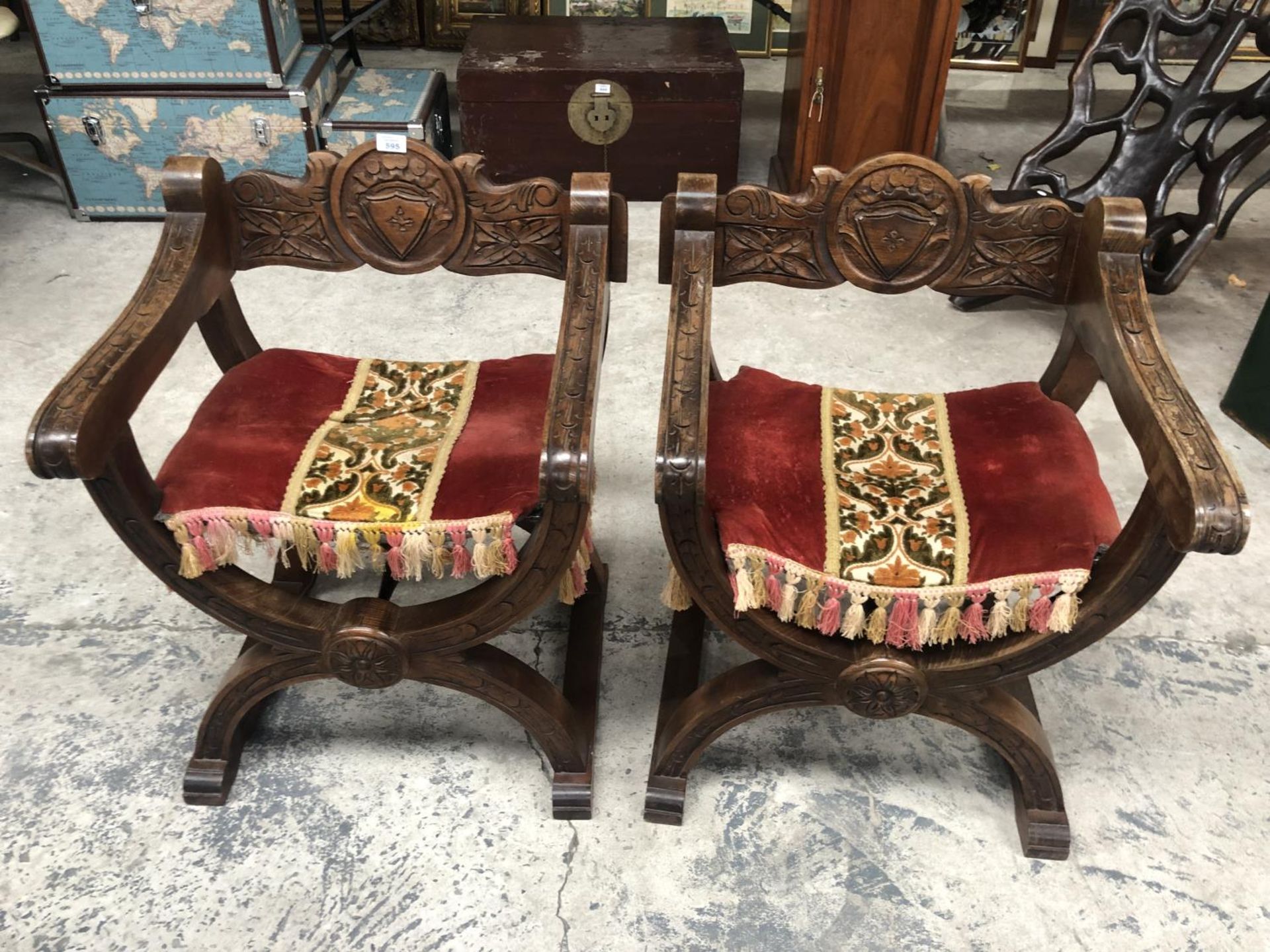 A PAIR OF ORIENTAL HEAVILY CARVED ARMCHAIRS