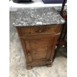 A WOODEN CABINET WITH A MARBLE EFFECT TOP