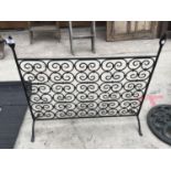 AN ORNATE CAST IRON FIRE SCREEN 79CM X 68CM