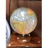 A LIGHT-UP GLOBE ON A STAND