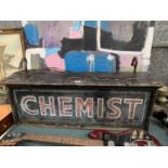 A LARGE VINTAGE BLACK METAL 'CHEMIST' SIGN FROM CHARNLEYS IN WILMSLOW WHICH CLOSED IN THE 1970'S