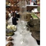 FOUR TALL GLASS VASES