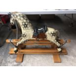 A GOOD QUALITY CHILDREN'S WOODEN ROCKING HORSE