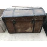 A VINTAGE WOODEN TRUNK WITH METAL STRAPPING (HANDLES A/F)