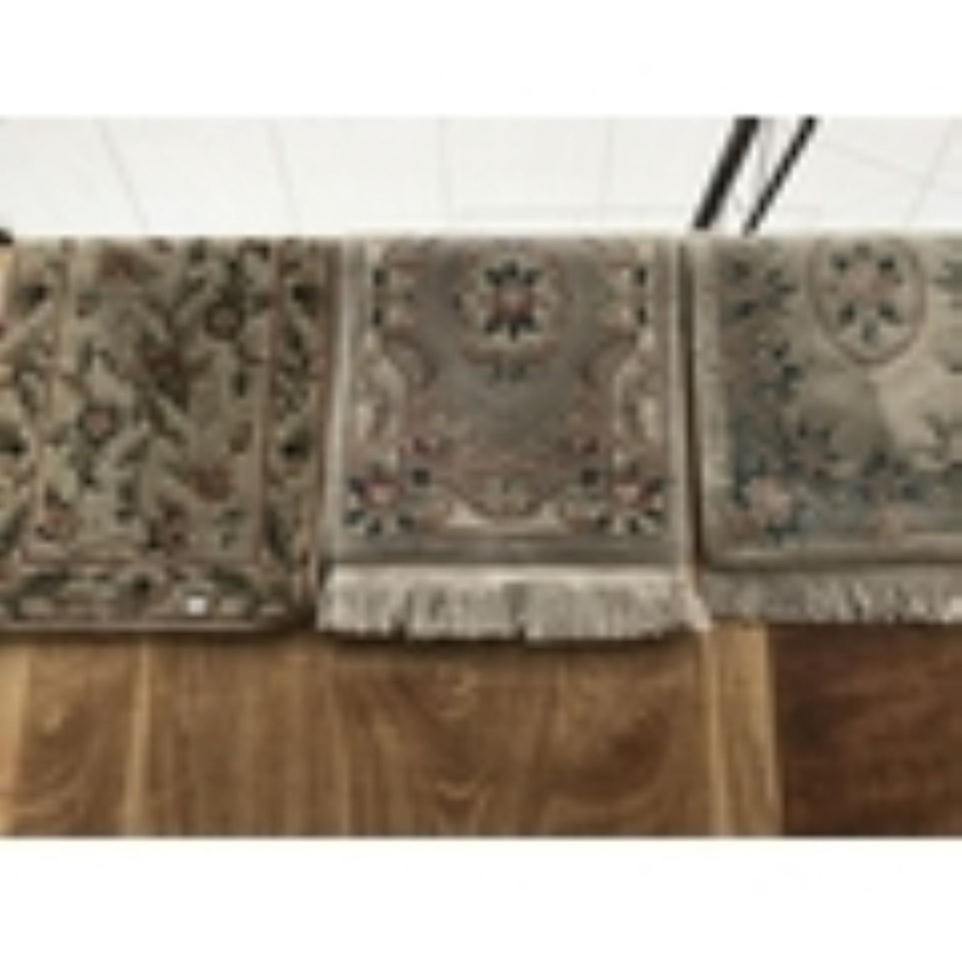 THREE DECORATIVE PATTERNED RUGS, TWO WITH FRINGING