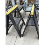 A PAIR OF PLASTIC FOLDING BUILDERS TRESTLES