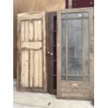 SEVEN VARIOUS VINTAGE DOORS TO INCLUDE THREE PINE PANELED 202CM X 80.5CM, 197CM X 80CM X 195 X 75.5,