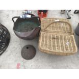 A BRASS COAL BUCKET WITH ORNATE WHITE AND BLUE POTTERY HANDLES, A WICKER PICNIC BASKET AND A DOLLY