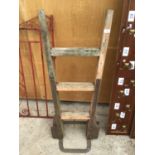 A VINTAGE CAST IRON AND WOODEN SACK TRUCK