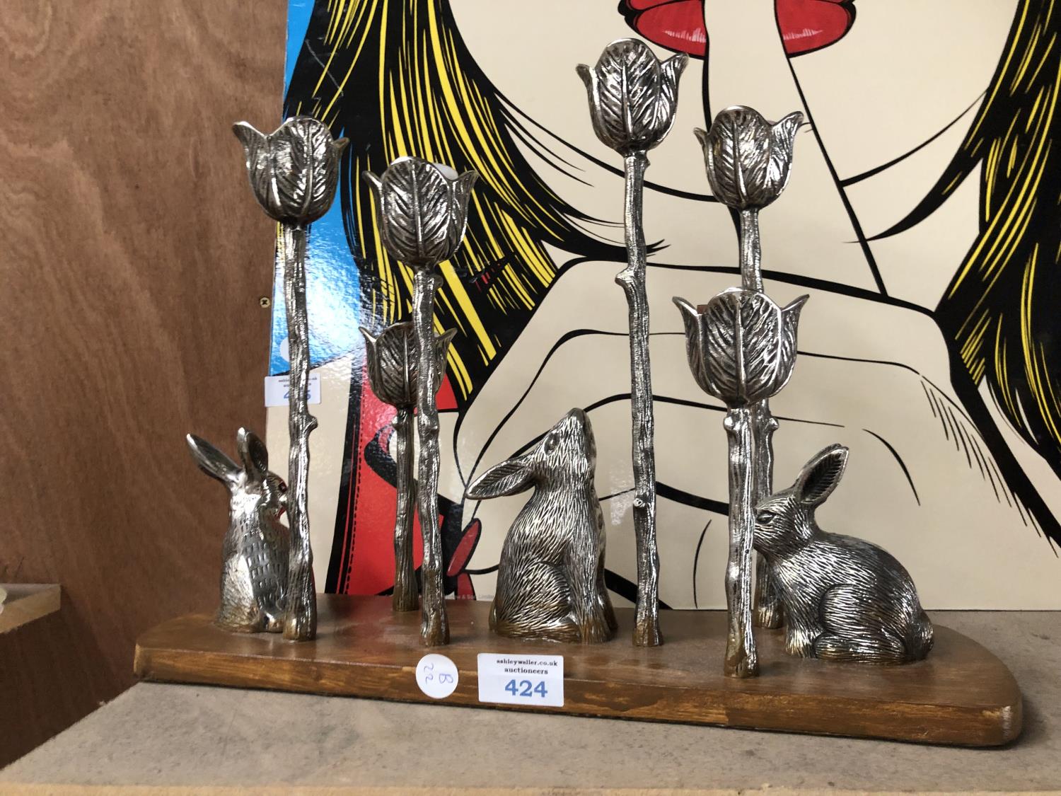 A SILVER PLATED CANDELABRA WITH RABBIT DESIGN