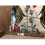 A SILVER PLATED CANDELABRA WITH RABBIT DESIGN