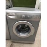 A SILVER BEKO WASHING MACHINE IN WORKING ORDER