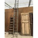 TWO LONG METAL LADDERS ONE ELEVEN RUNG ONE SIXTEEN RUNG