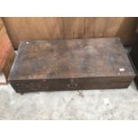 A WOODEN CHEST ON CASTERS 112CM X 53CM X 28CM HIGH