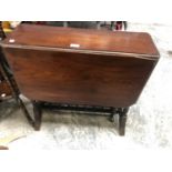 A MAHOGANY DROP LEAF TABLE