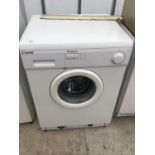 A CANDY WASHING MACHINE IN WORKING ORDER