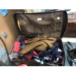 A VINTAGE SUITCASE AND CONTENTS