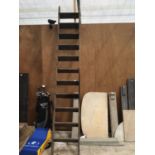 A VINTAGE ELEVEN RUNG WOODEN LADDER