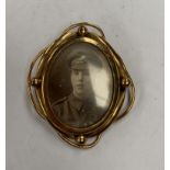 A DOUBLE SIDED PINCH BACK WORLD WAR ONE PHOTO BROOCH