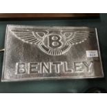 A CAST METAL BENTLEY SIGN