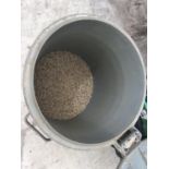 A BIN CONTAINING FISH FEED