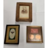 THREE PHOTO FRAMES TO INCLUDE VINTAGE STAMPS AND COINS