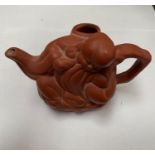 A ORIENTAL CLAY STYLE TEA POT