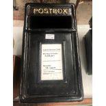 A CAST METAL BLACK POST BOX