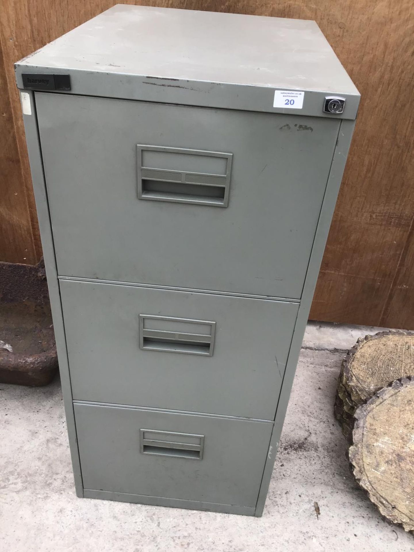 A THREE DRAWER METAL FILING CABINET