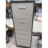 A FOUR DRAW METAL FILING CABINET