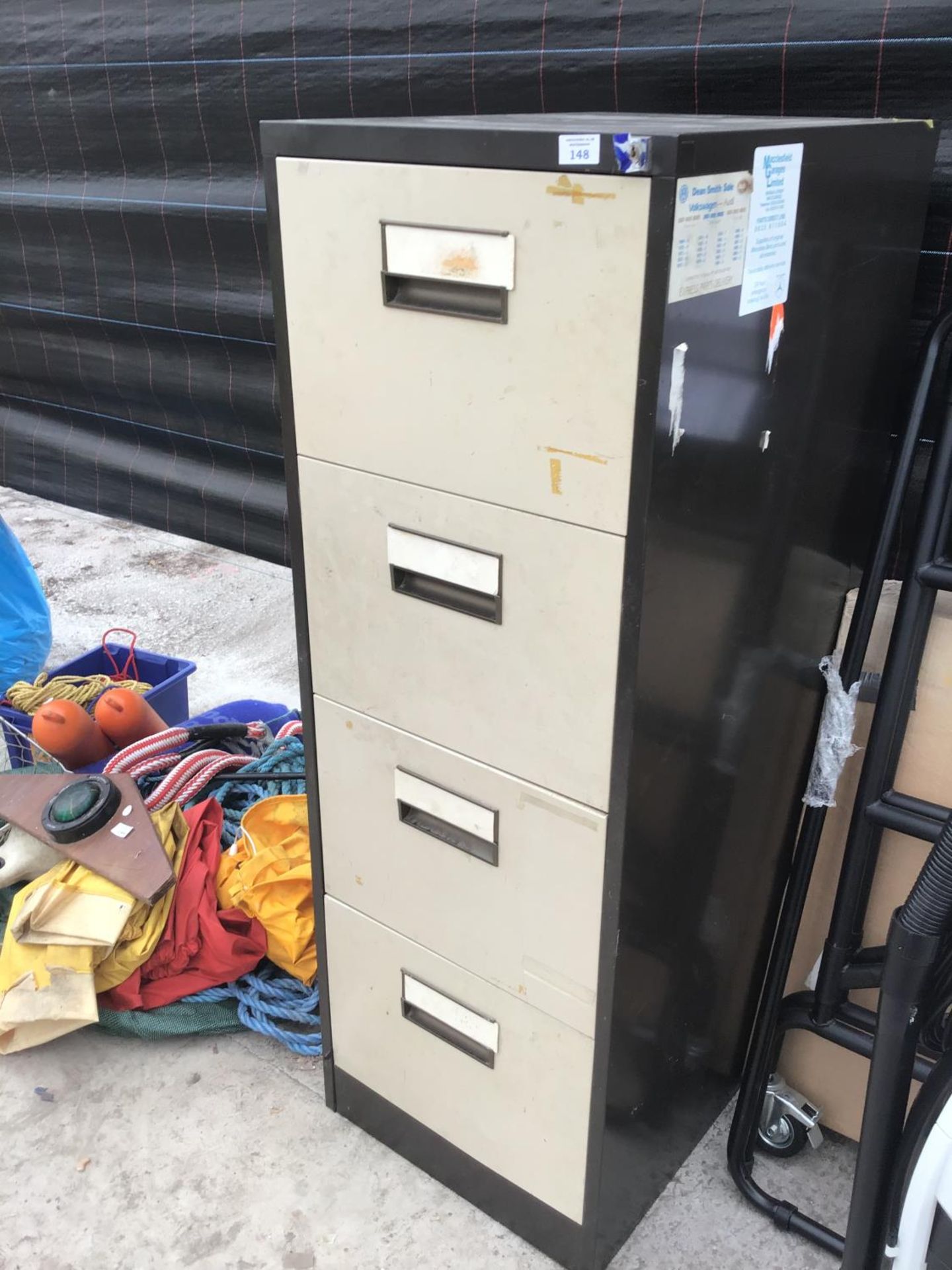 A FOUR DRAWER METAL FILING CABINET