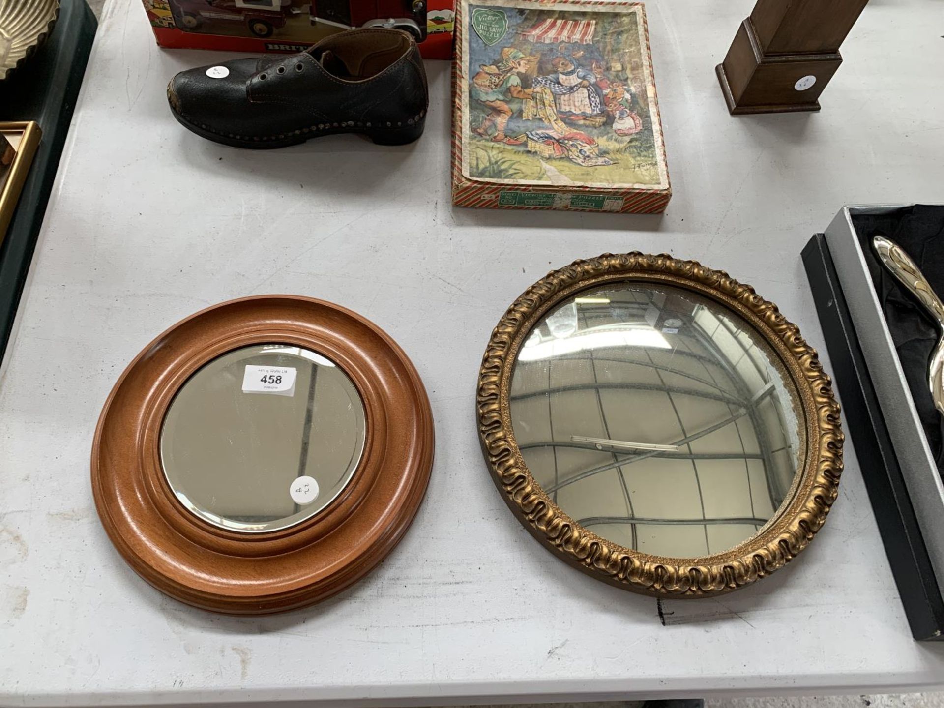 TWO SMALL CIRCULAR MIRRORS