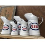 A COLLECTION OF FIVE ESSO OIL CANS