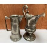 A PAIR OF TWO METAL PEWTER TANKARDS