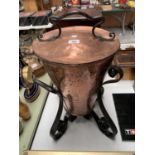 AN ARTS AND CRAFTS HAMMERED COPPER AND METAL BOUND COAL BUCKET