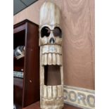 A LARGE WOODEN SKULL MASK