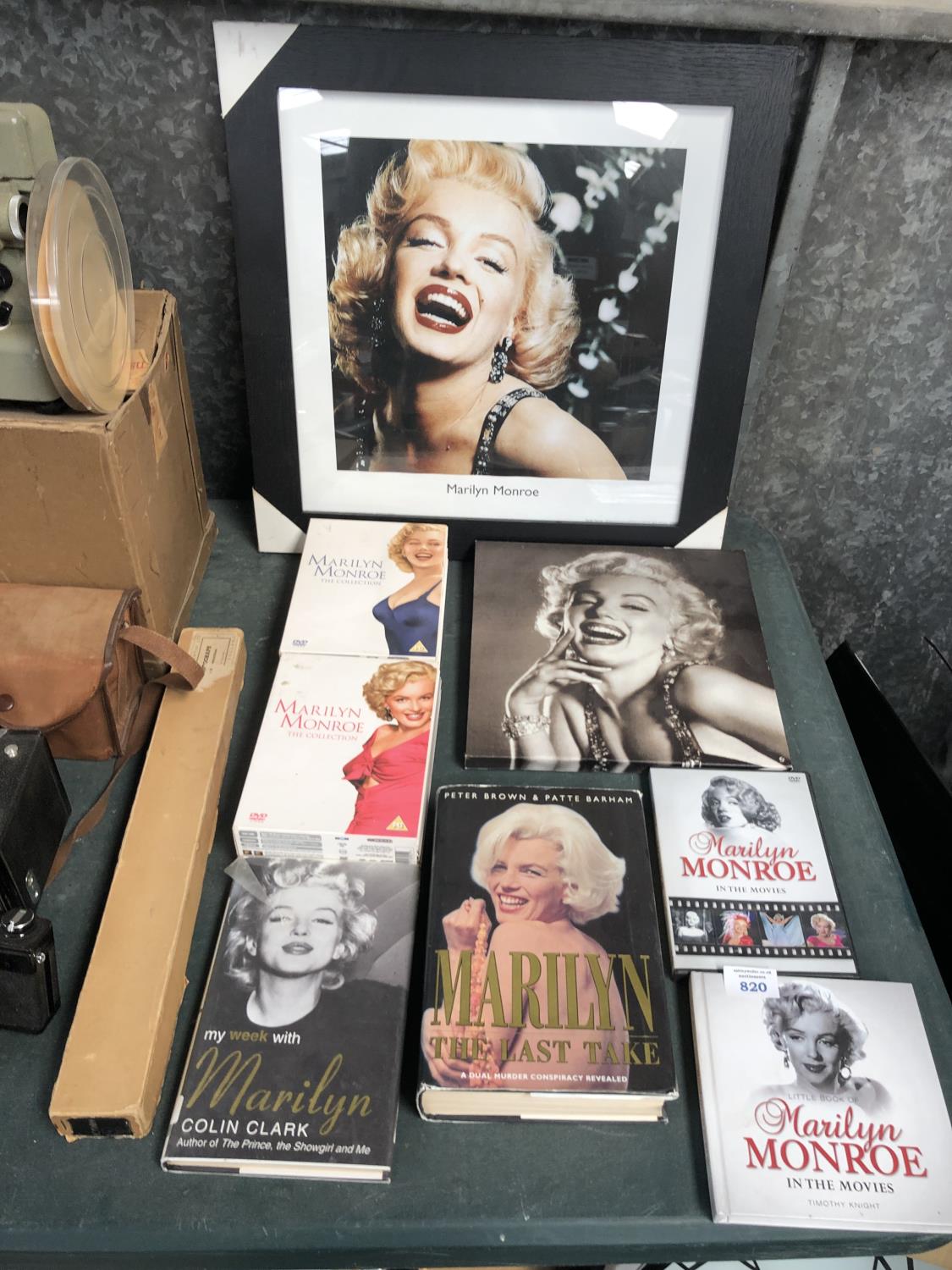 A COLLECTION OF MARILYN MONROE DVDS, BOOKS AND PICTURES
